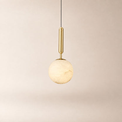Nuvlight Velriq pendant light with a spherical natural alabaster shade and warm brass accents
